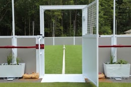 open door to soccer field